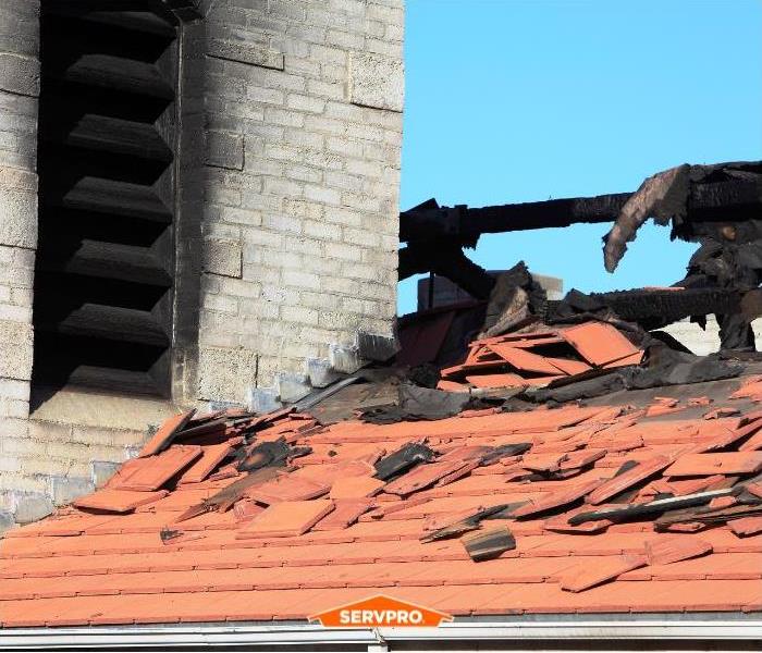 Smoke damage on a roof after a fire.