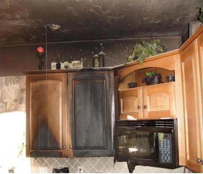 fire and soot damage in the kitchen of a home