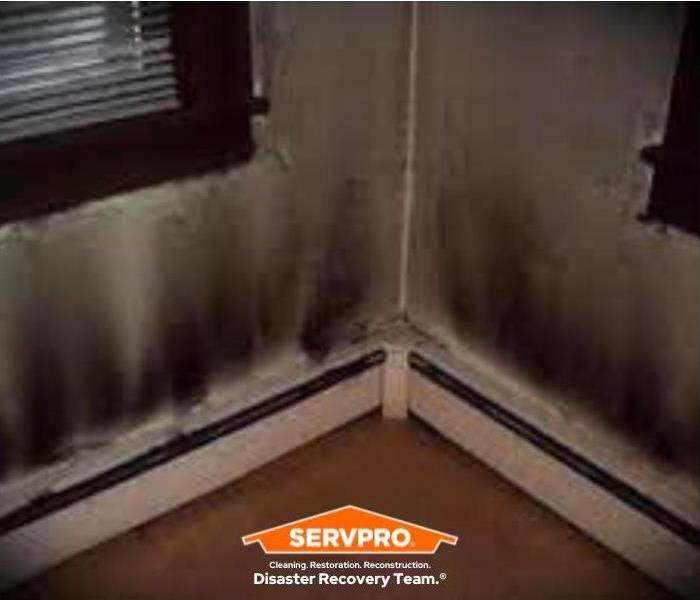 puffback and soot damage on walls of home
